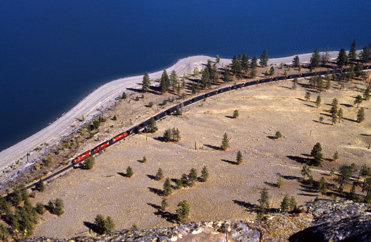Westbound CP freight running along Kamloops Lake's south shore.