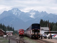 Remember those marvellous old Morant scenes, with westbound Selkirks cooling their heels in the siding while shiny streamliners made their station stop, disgorging passengers onto connecting tour buses?
Not much has changed - here's the eastbound Rocky Mountaineer unloading en route to Calgary.