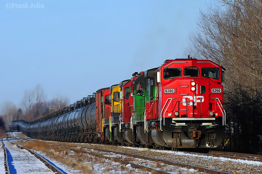 Destined for the Irving refinery at Saint John N.B, a Montreal Maine & Atlantic crude oil train idles at Farnham. A new crew will take over for the next 140 miles run to Megantic