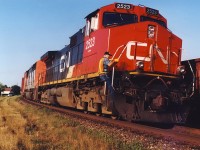 CN 305,s conductor climbs down as it comes to a stop to watch the 308 moving in the siding.
