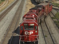 SD40-2 #5790 leads a sister and an SD90MAC through the switches and into the yard at Swift Current.