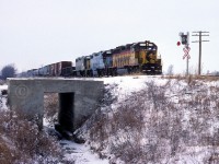 With the swinging banjos activated, CSXT 6131 and trailing units 2580 and 2578 lead train 321 across McKinlay Road at mile 186.28 on the Caso Sub east of Tilbury.