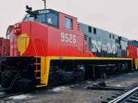 Bombardier built  Nacionales de Mexico  M424W #9526, part of order #6114 for 53 units including 9527, 9532 and 9533 (& others) in this March 1981 shipment. 
This sharp red-black-yellow paint scheme did not last, most units repainted two tone blue.
  Anyone know if some N de M  M424's operational today? 
<br>
More N de M :
<br>
<br>
 <a href="http://www.railpictures.ca/?attachment_id=8489"> Builders' plate </a> 
<br>
  <a href="http://www.railpictures.ca/?attachment_id=8486"> Builders' service bulletin plate </a> 
<br>
  <a href="http://www.railpictures.ca/?attachment_id=7817"> #9549 June '81 image by Ron Bouwhuis' </a> 
<br>
 CN Mac Yard. March 22, 1981, Kodachrome by S. Danko.