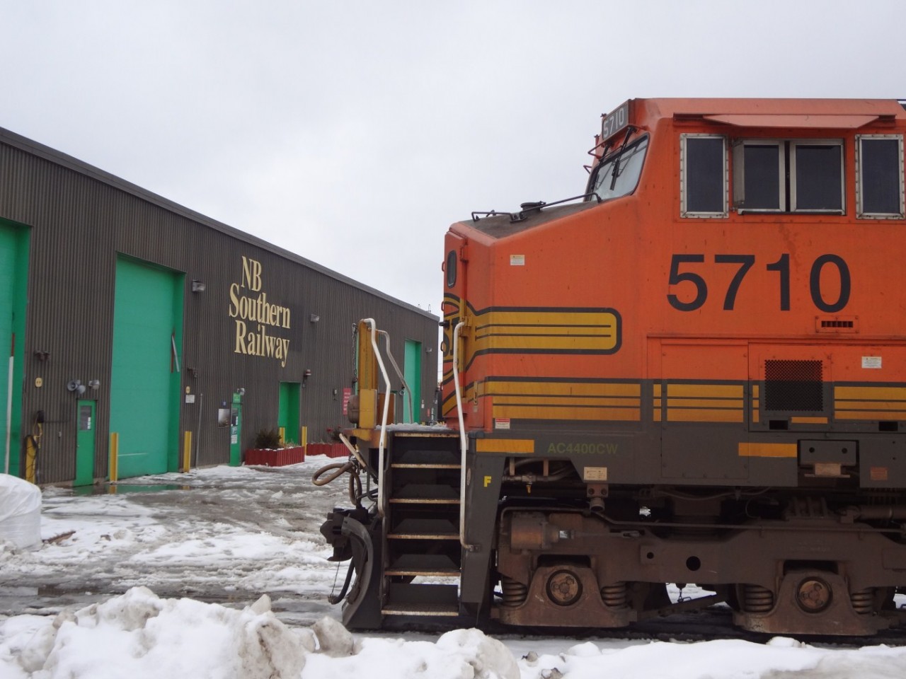 AC4400CW BNSF 5710 is a long way from home rails as it sits outside the main shop of New Brunswick Southern Railway in Saint John, NB. on this dismal February day. (D. Wylie photo submitted with permission).