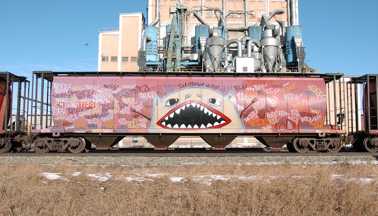 A neat catch in CN train 418 coming off the Westlock sub, this grain car has been used as a large canvas by the graffiti artist "Theory." While I don't find most graffiti particularly interesting, this car really caught my eye.