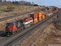 Starting into the climb to Newtonville, CN 2627 and BCOL4605 lead 149's train west just outside Port Hope. 1337hrs.