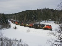 On a cold sunday morning in northern Quebec, CN 368 round another curve on the Lac St-Jean subdivision bound for Chambord,Qc and a connexion with Roberval & Sagueany Ry. For the record, consist include ES44DC 2321, C40-8M 2419, IC C44-9W 2717, CN SD70I 5625 and SD75I 5755. Out of view and working mid-train was C44-9W 2203.