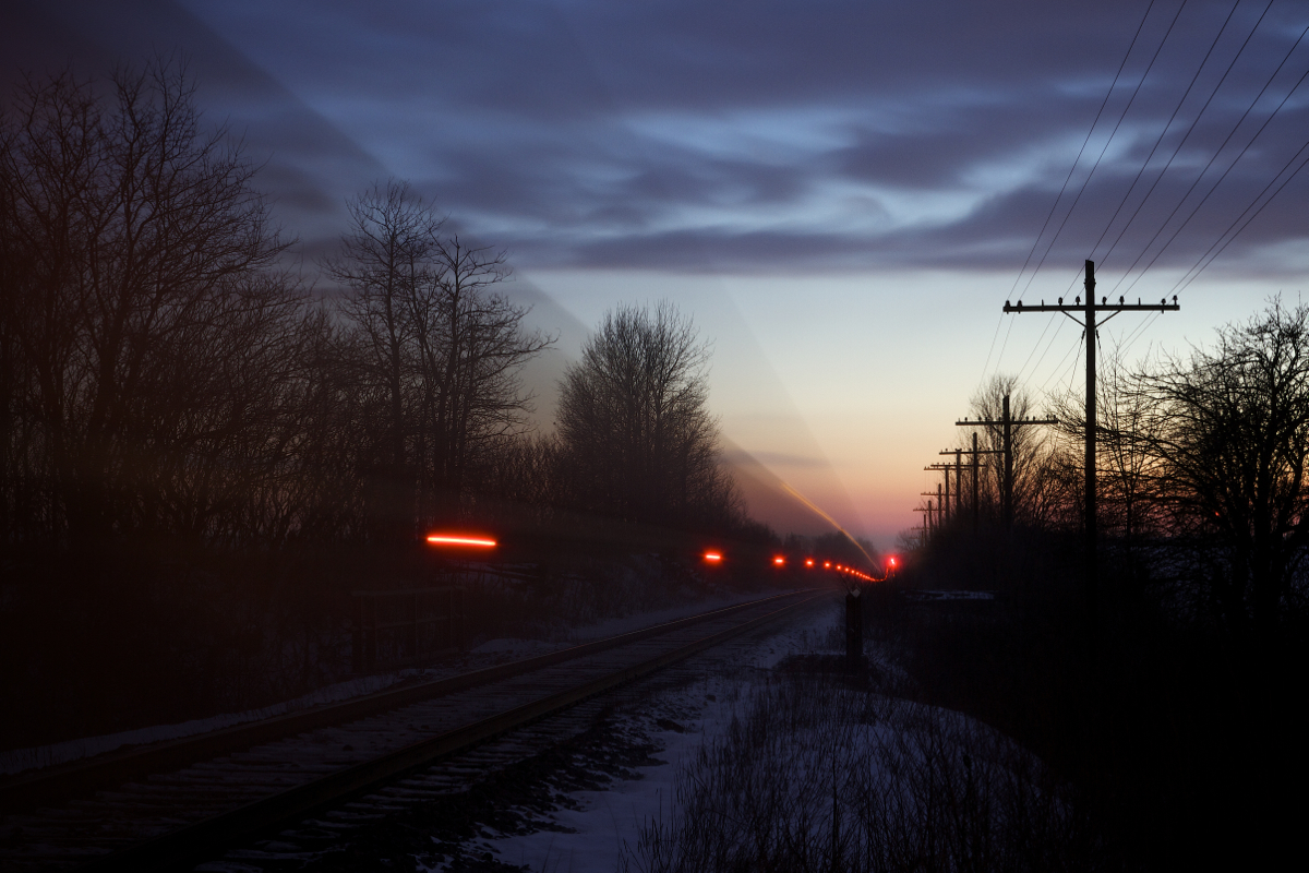 Canadian Pacific's Montreal to Chicago hotshot train # 143 streaks along the Galt Subdivision and up the grade at Puslinch on a frigid February evening.