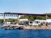 CP's old steam engine 2816 is seen crossing the Parry Sound trestle on its' way back to the North and west after a tour of Southern Ontario much to the delight of the fans. One can see the railfans' "photo-line" to the right of the white van.  It is understood that the 2816 may never run again on CP, and is up for sale.