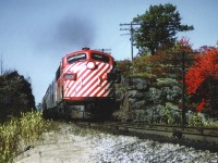 Toronto-bound section of the "Canadian" barrelling along on the approach to MacTier, Ontario on a gorgeous fall day back in 1975. This GMD FP7 was built in 1952, never did become part of VIA but instead went to CTCUM (Urban Transit Commission-Montreal) in 1982 and later became AMT 1305.