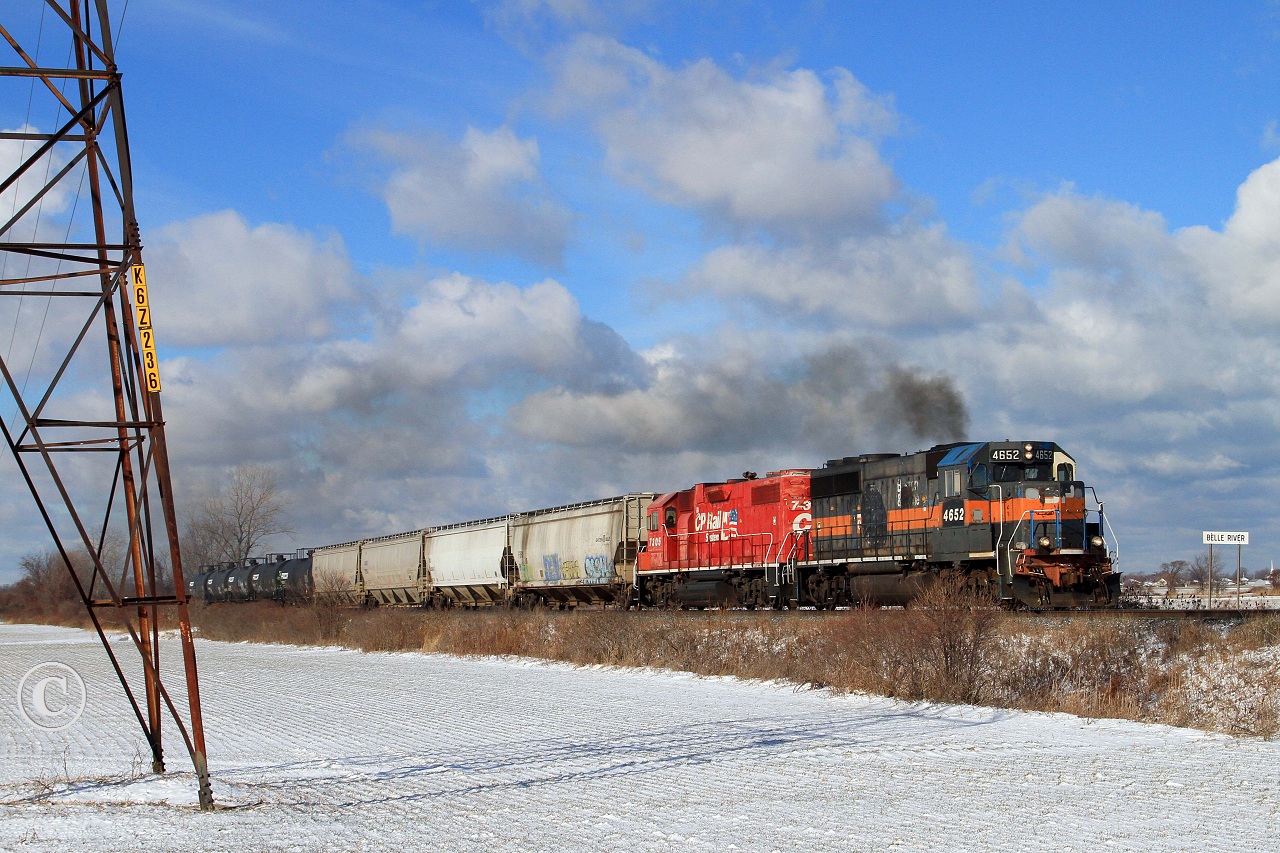 Ratty looking ex B&M CP 4652 and ex D&H CP 7305 lead train T76 eastward at the Belle River mileboard.