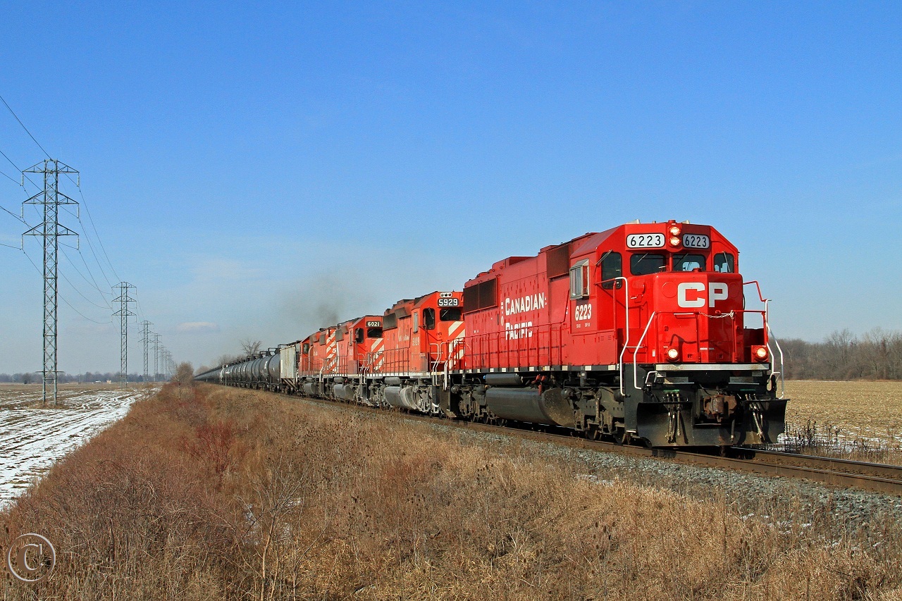 A rather spring-like morning sees CP 6223 with trailing SD40-2's 5929, 6021 and 5972 hustle train 642 eastward at mile 98.88 on the CP's Windsor Sub. Nice to see an all EMD consist these days.