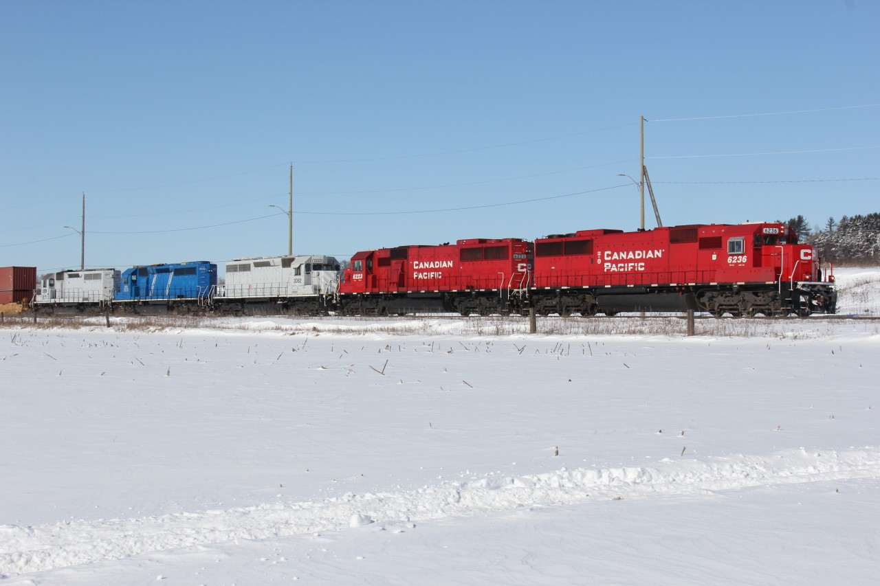 CP 282 backs up his train to continue doing work (they lifted some autoracks on the head-end).