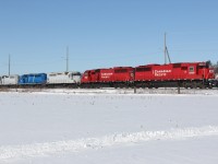 CP 282 backs up his train to continue doing work (they lifted some autoracks on the head-end).