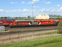 [Ed note: Rare occurence of the last two of its kind overwhelms the less than ideal location] CP 5911 and sister unit CP 5863 work the west end of the yard. These are the only two units on CP's roster that still wear the large multi-mark. After CP settled the labour dispute last year these two units worked together for about a week.