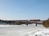 CP 606 crossing the Grand River at Galt on Feb 13/2013. 
As many times as I have been to Galt, this is my first photograph with a train on the bridge. 