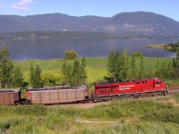 CP 8778 pushes hard on the rear of this coal train as it skirts along the shore of Shuswap Lake in Salmon Arm.