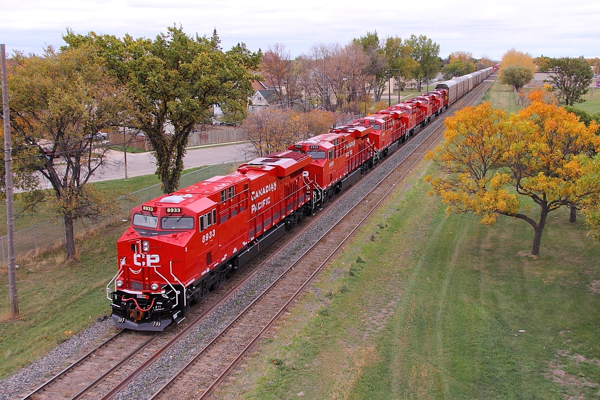 CP 8933 and five other brand new ES44s lead CP 111 into Winnipeg.