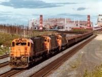 Cartier Rwy M636 87 leads sisters 75 and 76 northward with a train of empties from the Iron Ore processing Plant at Port Cartier. Loads are picked up at Mont-Wright in the north to be brought down to Cartier where the processed product is shipped out from the St. Lawrence River port.