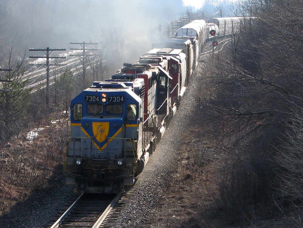 Now this was a stellar consist! DH 7304 back from maintenance in the states, leads train 242 along with HLCX 6304 (ex SP) and SOO 6062, through Lobo. Once at London, the train would sit until dark before heading down the Galt Sub.