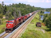 A pair of SD90MACs head for Kenora and points west with grain empties.