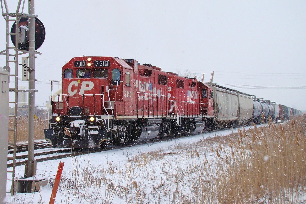 The Chatham way-freight pulls into Walkerville yard where he will make a lift behind 7310 & 7305 hauling 20 cars.