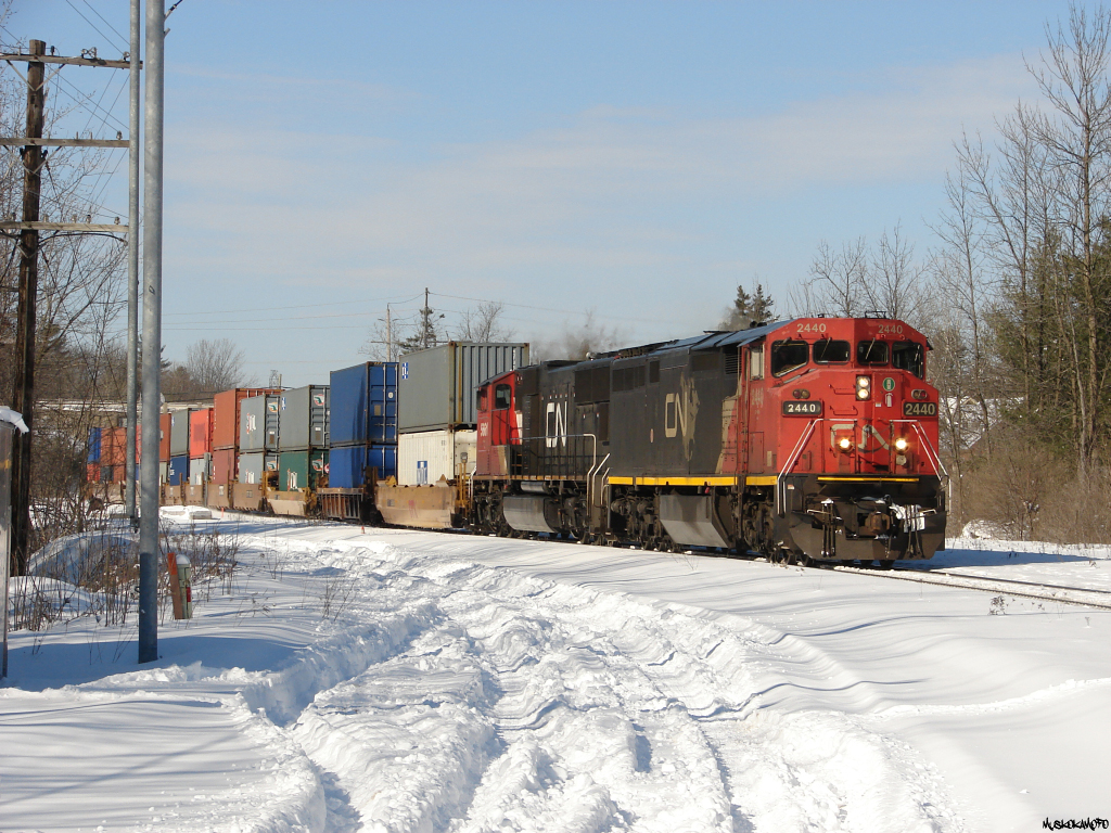 CN X10450 05 - CN 2440 South make's it's way through Washago heading down to Smail to hold back clear of any crossings while CN 101 and 190 get walked over a broken rail (5 MPH) down at the South end of Brechin East further ahed. Once 101 was clear and 190 had started to pull, X104 would make it's way down to tuck into the Siding at Brechin East and follow 190's slow path. Interestingly enough, 190 and X104 had been within about 35 mins of each other since originating in BC on Feb 5th! Precision railroading at it's finest!