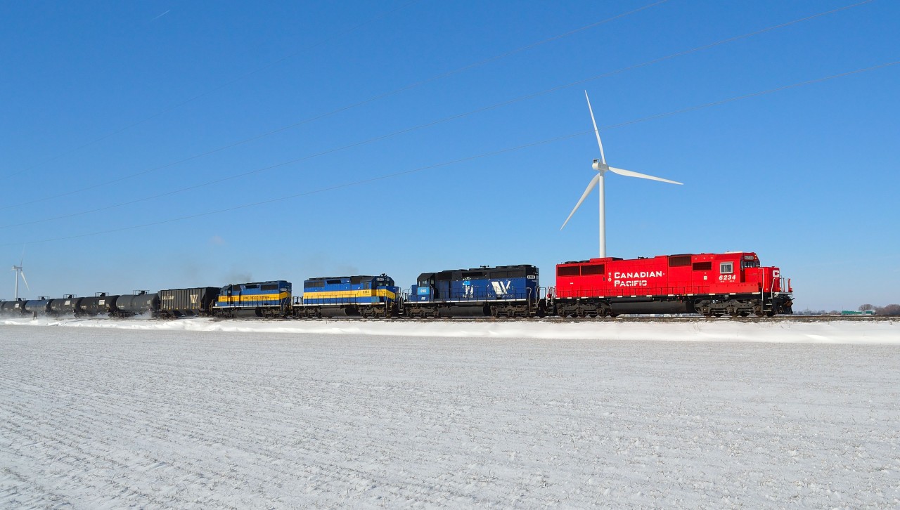 CP 642 led by rebuild 6234 (ex SOO 6034) and a colorful all EMD consist, heads eastbound thru Haycroft mile on this mild winter day.