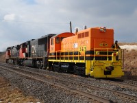 CN 331 had Tazewell & Peoria SW10 1352 in tow on February 12, 2012, heading back home after rebuild at the Buffalo & Pittsburg shop in Brookville, Pa. Here it is at Paris West backing to make a lift. Sister unit TZPR 701, expected to be rebuilt as TZPR 1351, has been at Brookville for almost a year getting rebuilt.