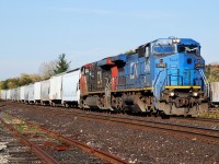 IC 2460 leads 398 past the yard in Brantford, ON. The unit trailed on 332 today, February 28, 2013, and now has a CN "noodle" on the nose and web address added to the side.