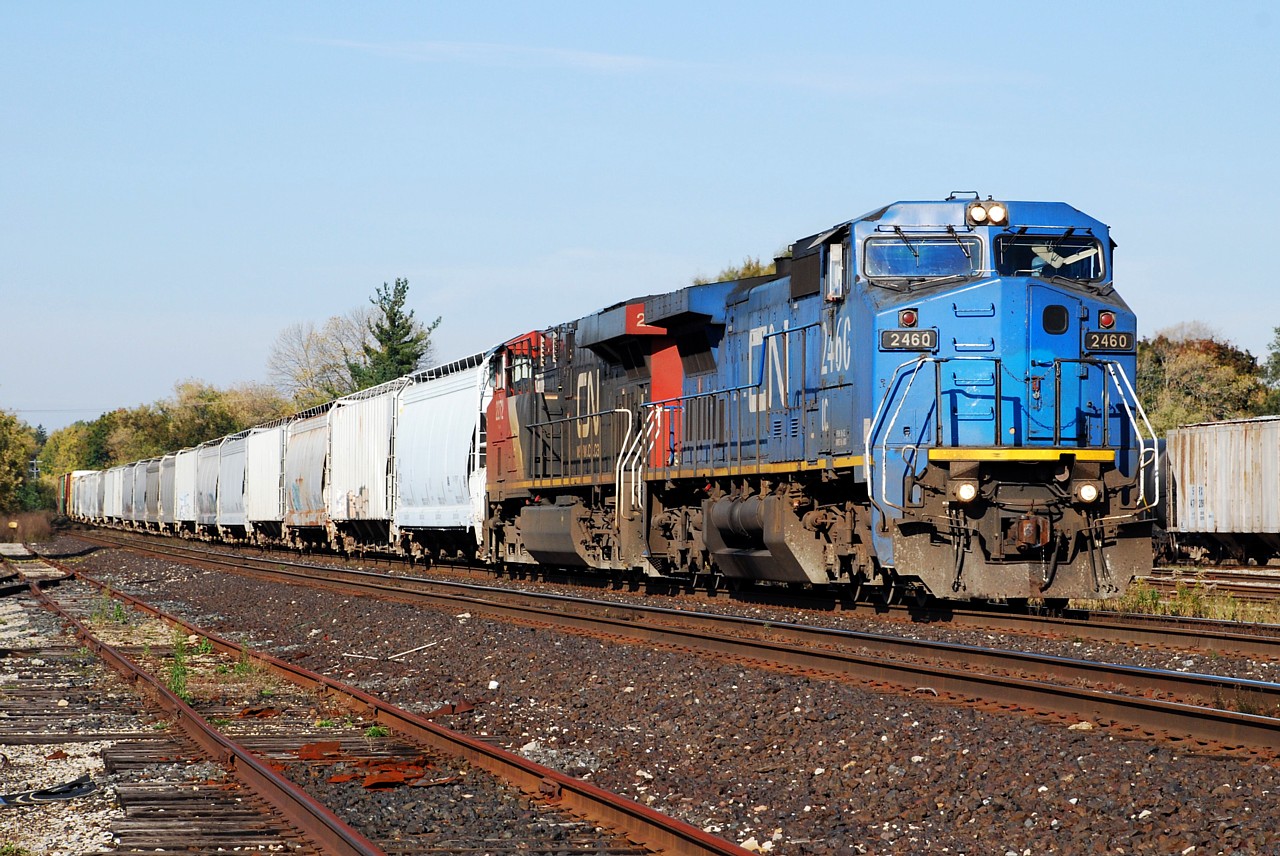 IC 2460 leads 398 past the yard in Brantford, ON. The unit trailed on 332 today, February 28, 2013, and now has a CN "noodle" on the nose and web address added to the side.