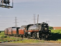 Eight plus years have passed, not expected to be repeated soon, so enjoy the view....major 2012 changes at the CPR Board of Directors - generated by the New York activist shareholder William Ackman (who effectively controls 14.2% of the CPR shares) - has re-focussed CPR management on improving shareholder value..... Nostalgia not on CPR management's agenda for the foreseeable future. ( Although thankfully the Christmas (Holiday) Trains did operate in 2012 ). CPR Hudson 2816 makes a low profile arrival at Tapscott (Agincourt) pulling in through the connecting track route on a sunny late afternoon June 2004.  Fuji film negative by S.Danko.
<br>
More live steam, CPR Hudsons:
<br>
<a href="http://www.railpictures.ca/?attachment_id=7412"> at Cherry Street </a> 
<br>
<a href="http://www.railpictures.ca/?attachment_id=5724"> at Streetsville </a> 
<br>
sdfourty.

