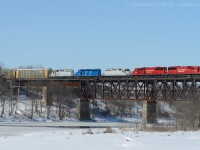 CP 282-07 crosses the Galt Bridge with a few leasers and a pair of rebuild SD60's (ex SOO) on the head end.