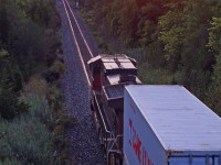 Very Early and with a single unit 106 heads into a sunrise approaching the Kingston Sub in Pickering Ontario.