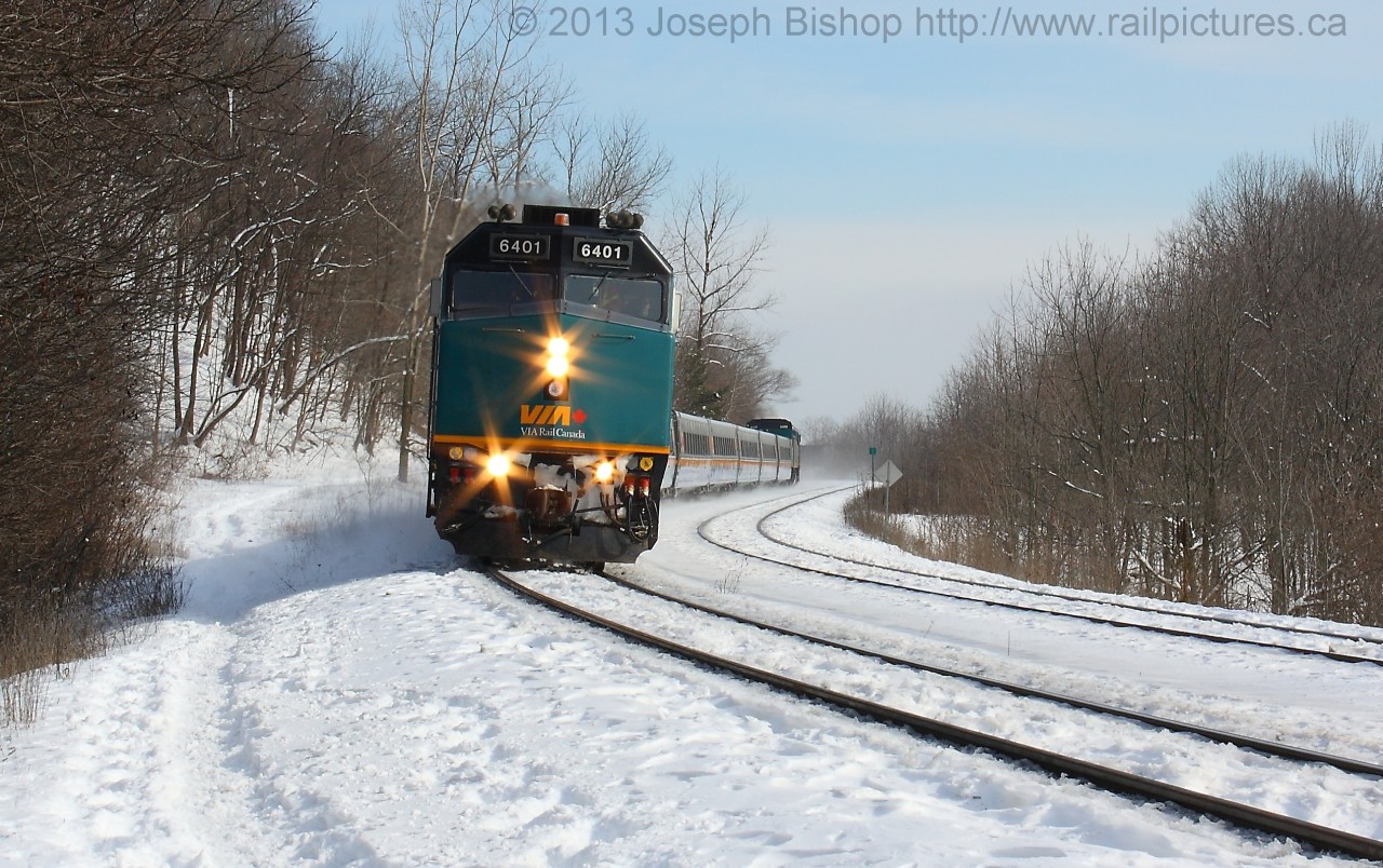 Via 73 with locomotive number 6401 on the point negotiates its way through Dundas Ontario on the North Track on the CN Dundas Subdivision