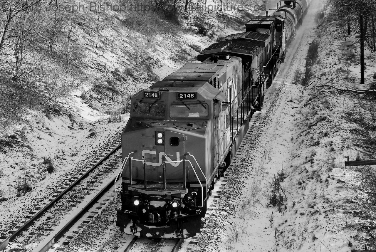 CN 2148 rushes a short CN 331 through Copetown Ontario on a chilly morning.  CN 2148 was my first ex BNSF unit that I caught.  Note it also has the split cooling modification at the rear of the locomotive.  This is my 100th photo on Railpictures.ca