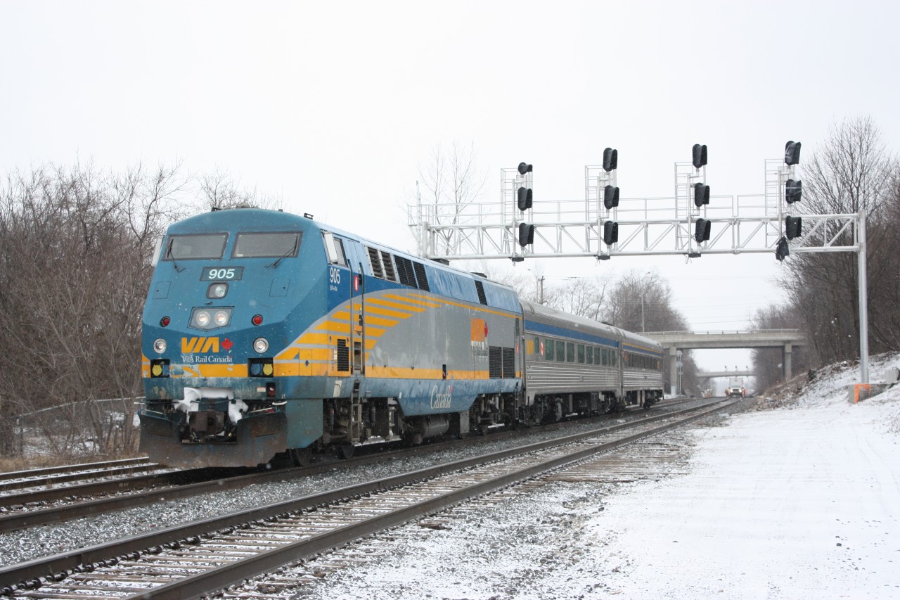 VIA #85 passes the new signals just east of the station, where a third track will soon be installed while the new crossover switch on the south track is being worked on.