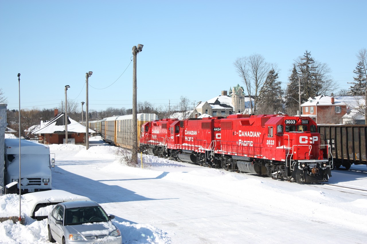 Cp Galt job with three freshly overhauled GP38, including former SOO 4424 back past Galt station before heading up the former Grand River RR to the Toyota plant.