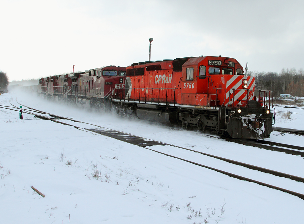 Train 234 hustles through Guelph Jct with a veteran SD40-2 leading three GEs.