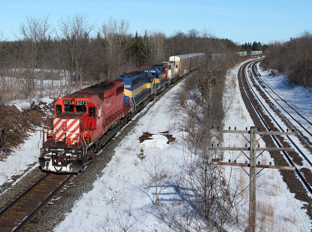 CP 643 pulls around the curve at Lobo with a nice lashup. Fourth out is one of only two active SOO SD60s.