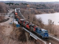 Back when hearing #331 meant the train was a Toronto to Fort Erie job, leased C40-8W LMS 718 leads CN5035, 9405 and 9590 around the bay past the ongoing improvements of CP trackage for the GO Transit expansion. Todays #331 designate is a Port Robinson to Sarnia train, I believe. One has to wonder how the fisherman on the extreme right of the photo got to his spot. He had no boat.