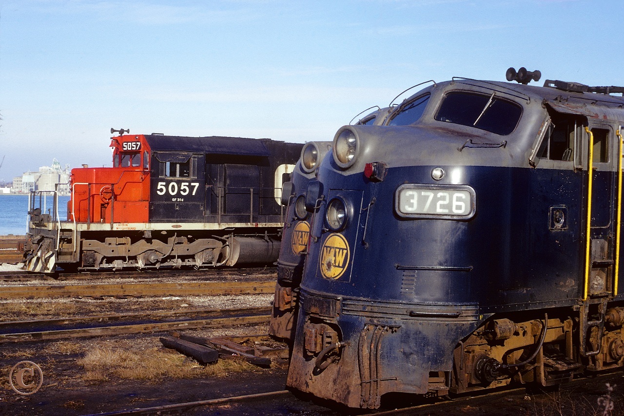 N&W 3726 and 3725 with CN 5057 await assignment at the CN Boat Yard engine facility in Windsor January 7, 1975.