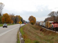 OSRX 644 - OSRX 175 pulling a long string of cars towards the CP Yard in Woodstock of a typical late October day
