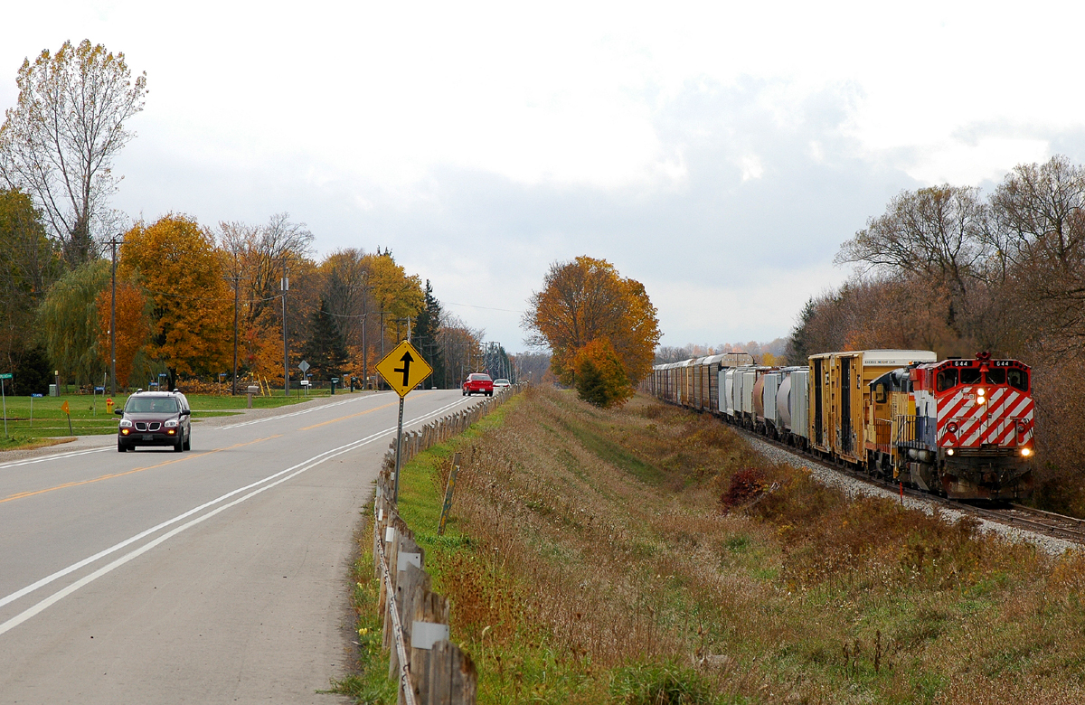OSRX 644 - OSRX 175 pulling a long string of cars towards the CP Yard in Woodstock of a typical late October day