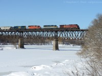 A loaded Ethanol train heads across the Grand River at Galt, Ontario with a couple visitors from the US.