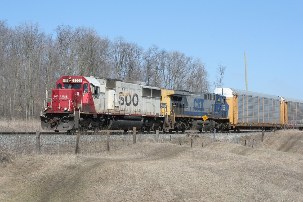 During a study break from preparing for my final exams before graduation, a nice warm spring day finds me at the CP Galt Sub in hopes of catching a train or two. When I heard SOO 6031 West switching the yard at Wolverton I wasted no time to get to this spot. Here we see SOO 6031 and CSXT 332 departing the West Begin/End CTC Sign Wolverton (WOL) after completing their work.