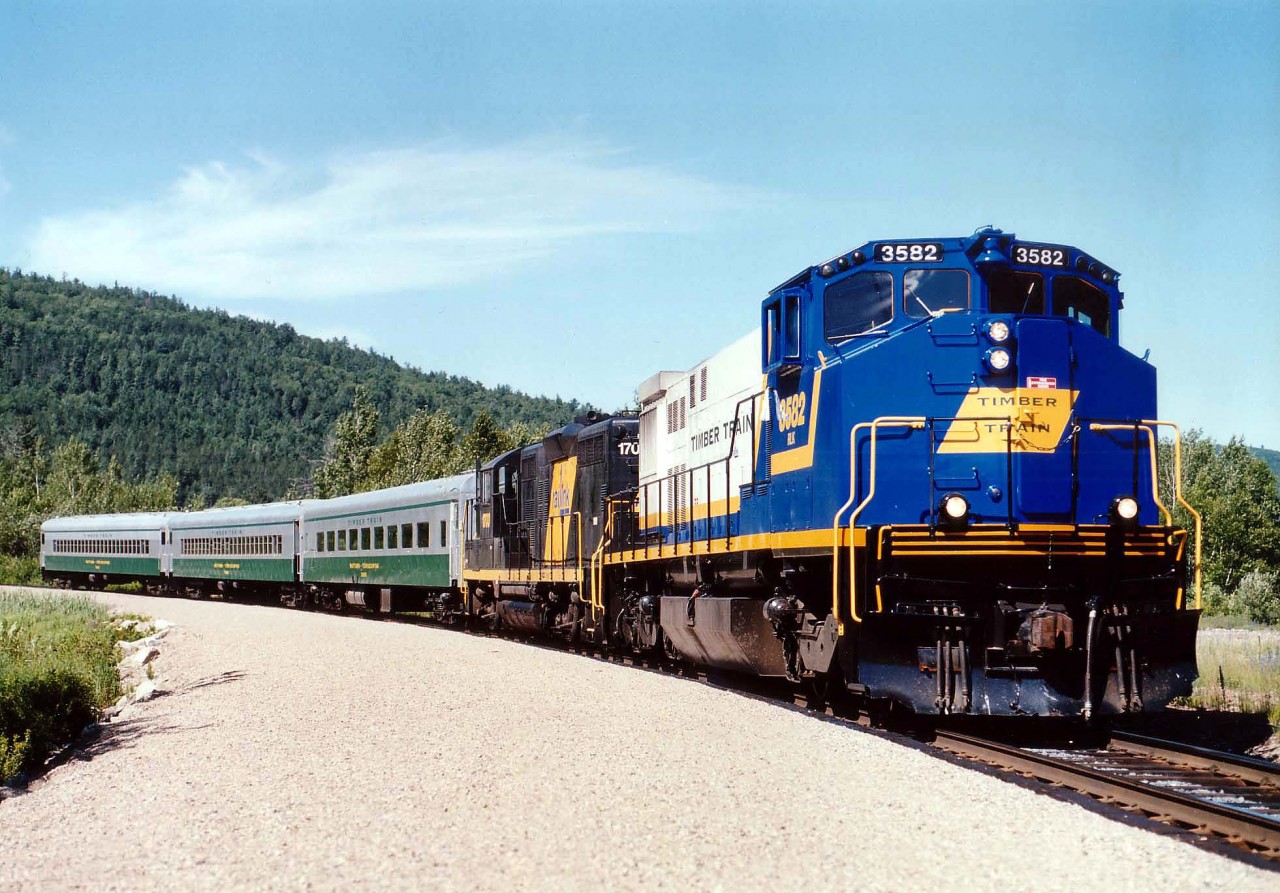 A lot of fans have seen the attractive paint scheme on this HR412(W) 3582 as it toils these days on the Trillium Railway, but few did see it running as the main power on the Mattawa-Temiscaming Excursion Company, a short lived tourist experiment that started up in 1998 and died in 2000. On a beautiful day in Mattawa we see the OVR 3582, 1703 bringing the train back westbound. The 3582 began life as CN 2582, and the GP9E as SP 5602, and she was scrapped in 2008. The excursion train was a good idea, but it just didn't catch on. Perhaps poor marketing? The coaches now roll on the Adirondack Scenic RR in New York State.