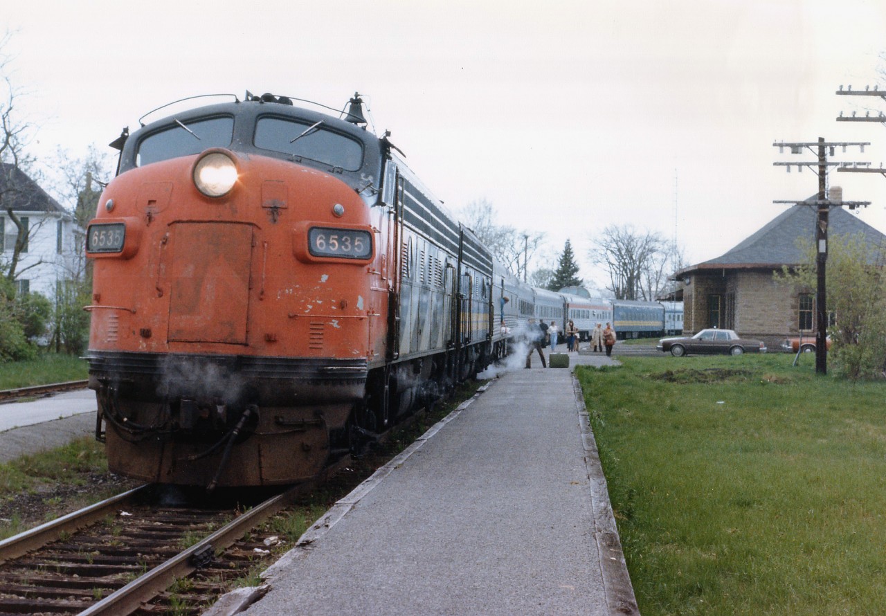 Heading eastward, the Montreal section of the VIA Canadian No.2 stops for passengers at the classic old CP station at Carleton Place, ON. Being early 1981, we're only 3 years into the formation of VIA, and the consist of this train attributes to that. The "CN" is showing thru the tattered paint of the leader, B unit 6621 sports the new blue & yellow scheme, as does the 5th car, but heritage CP and CN coaches are very evident. Of course this is part of the trackage that has made all the news lately, track has been taken up all the way up to Mattawa, a distance of close to 200 miles. In town here, the station still stands, but the track is only a fond memory.
