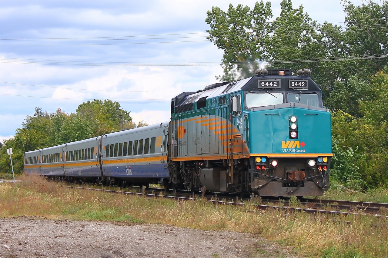 Rebuilt F40PH-2d #6442 approaches the scene where train 74 had it's fatal wreck over a decade ago; horn sounding for the next crossing ahead.