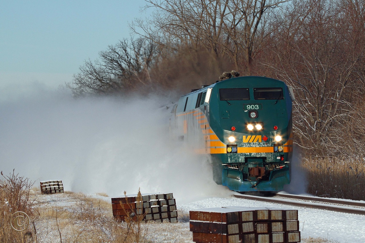 A tie replacement program is evident on the VIA portion of the Chatham Sub as Toronto bound VIA 903, with train 72, kicks up the snow at Puce Ontario.